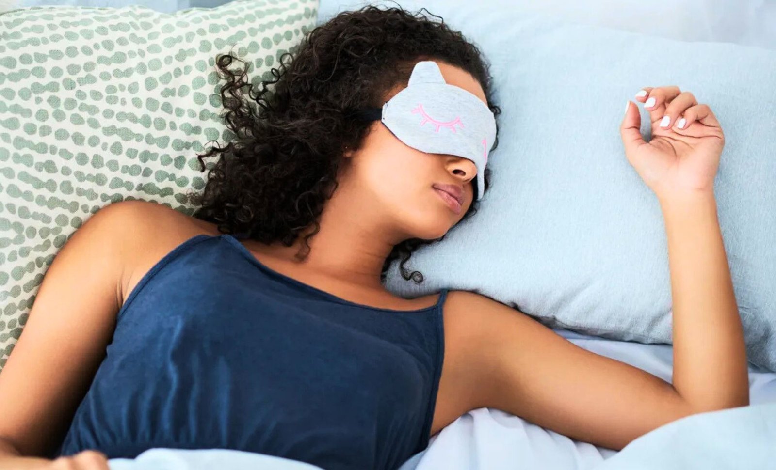 A woman sleeping in her bed.